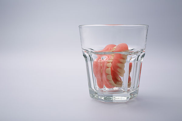 denture care; denture in a soaking solution